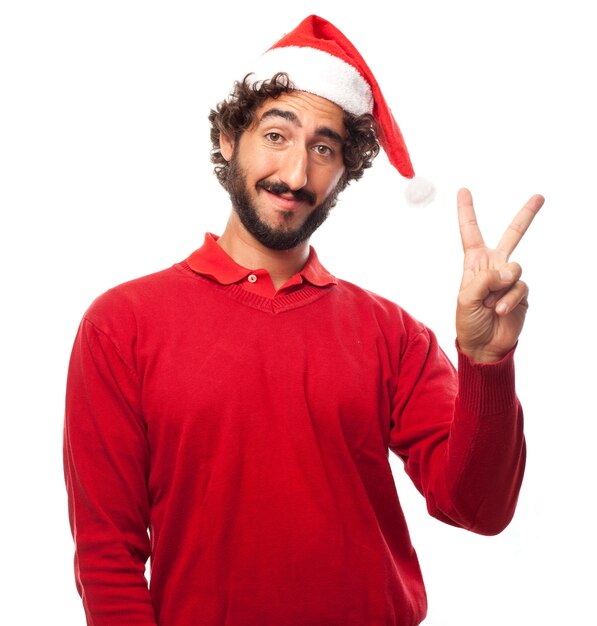 L&#39;homme avec un chapeau de père noël avec deux doigts levés