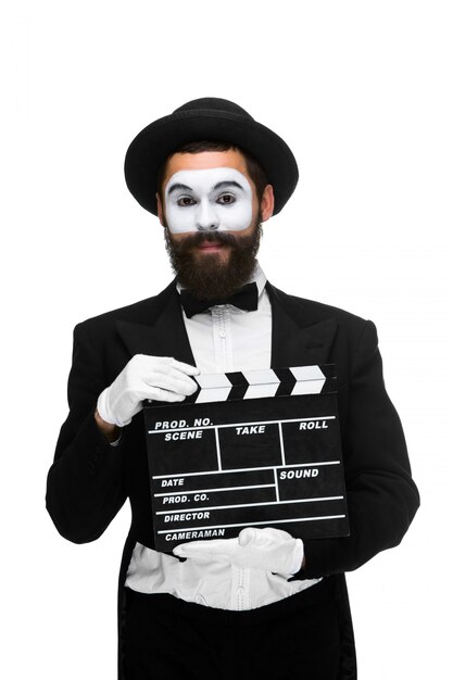 homme dans l'image mime avec film board