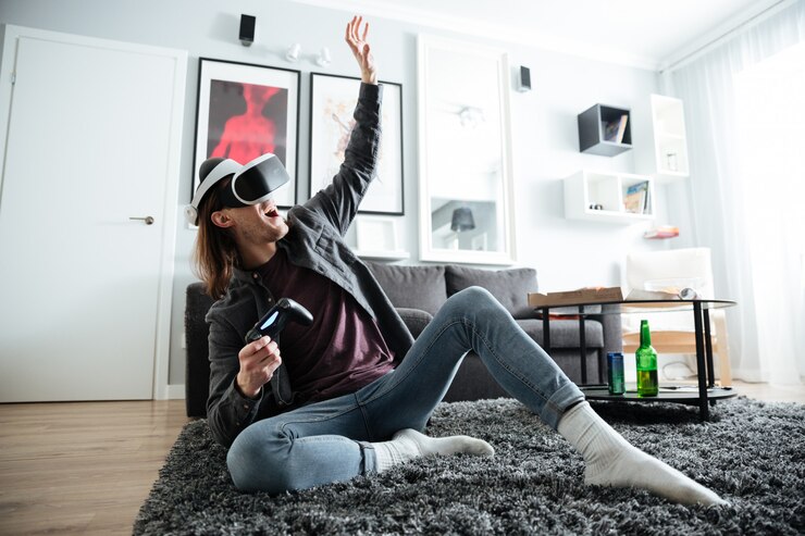 Photo gratuit homme heureux à l'intérieur jouer à des jeux avec des lunettes de réalité virtuelle 3d
