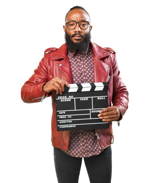 L&#39;homme avec la veste rouge et un clapperboard