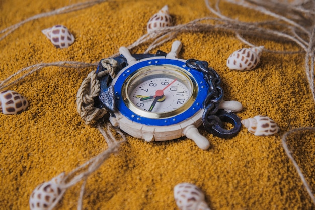 Photo gratuite horloge dans le sable
