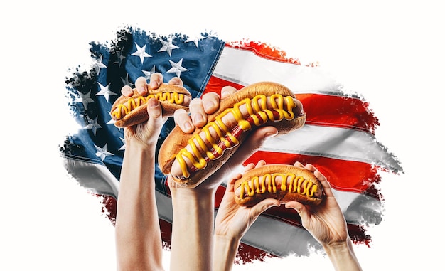 Hot dog américain classique à la main sur fond de drapeau américain