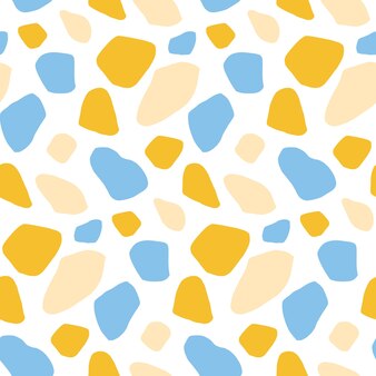Imprimé terrazzo bleu jaune et beige sur fond blanc ornement mosaïque