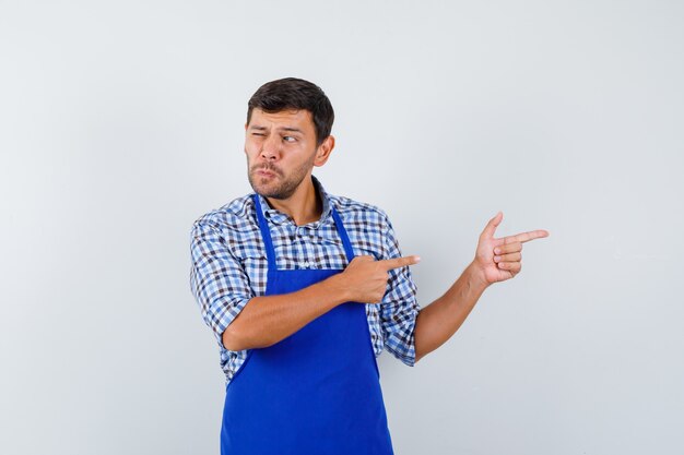 Jeune homme expressif posant dans le studio