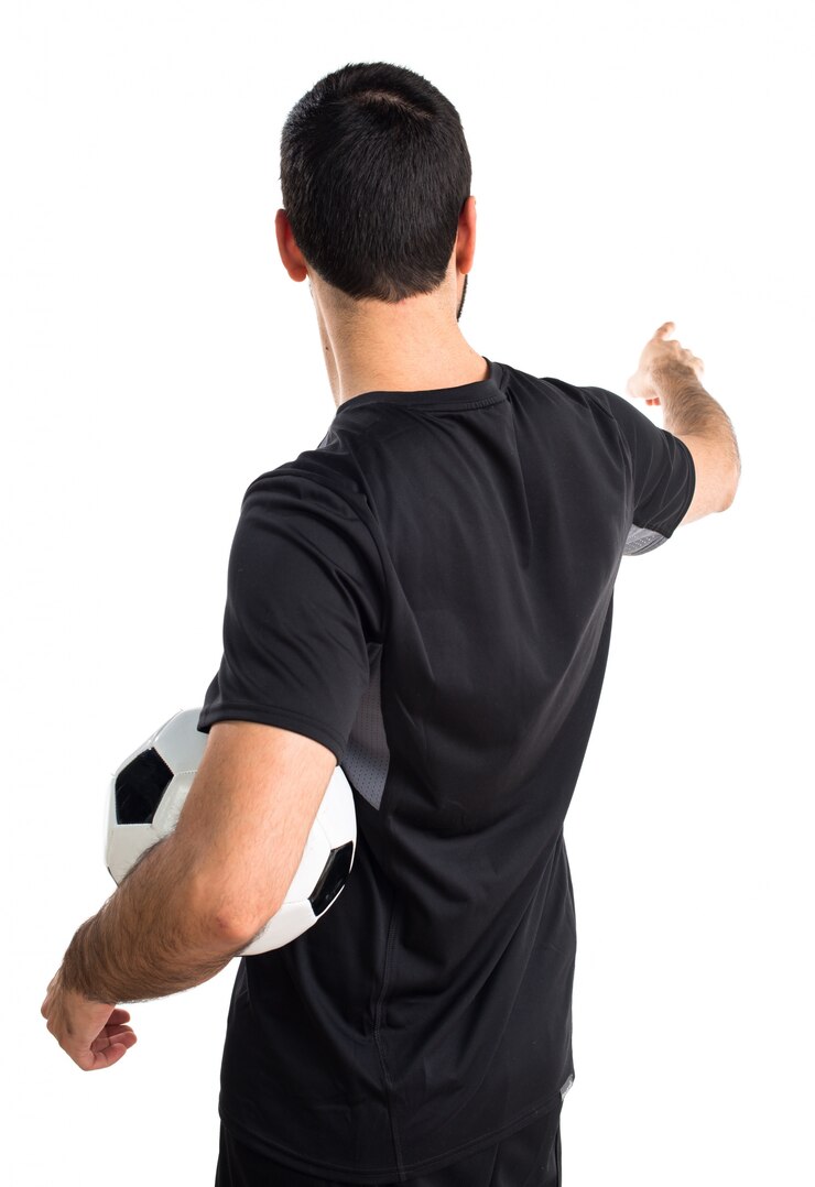 Photo gratuit joueur de football pointant vers le bas