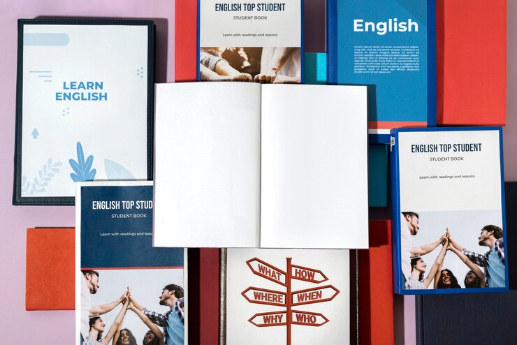 Photo gratuit livre anglais reposant sur la table de l'espace de travail