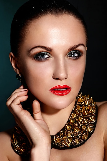 Look haute couture. Glamour closeup portrait of beautiful brunette Caucasian young woman model with Healthy hair with perfect clean skin and accessoire jewelry