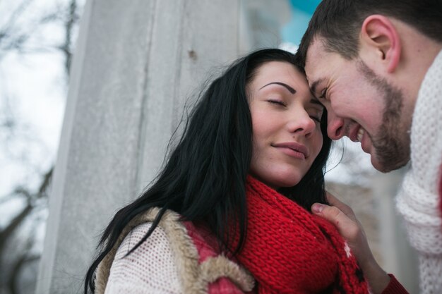 Loving man and girl in warm sweaters