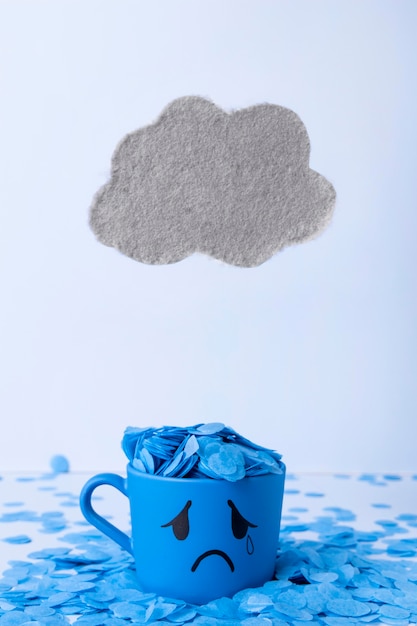 Photo gratuite lundi bleu avec tasse de larmes et nuage