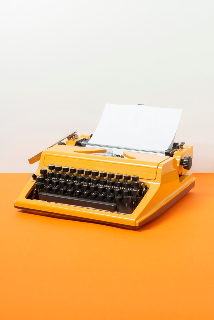 Photo gratuit machine à écrire rétro aux couleurs vives avec clavier et boutons