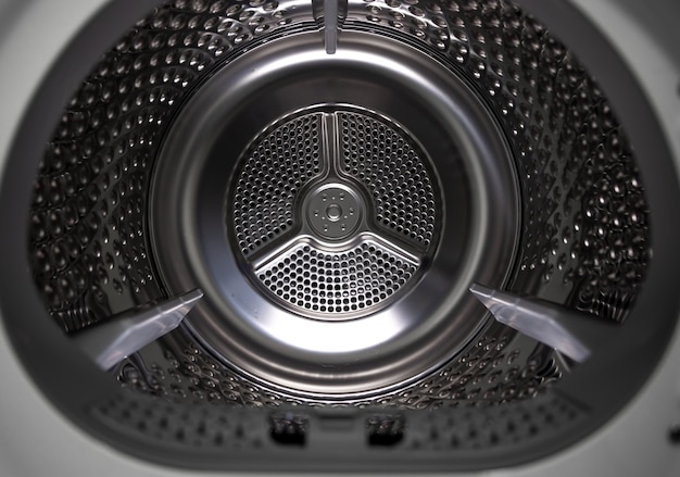 Photo gratuite machine à laver sèche-linge vue intérieure d'un tambour.