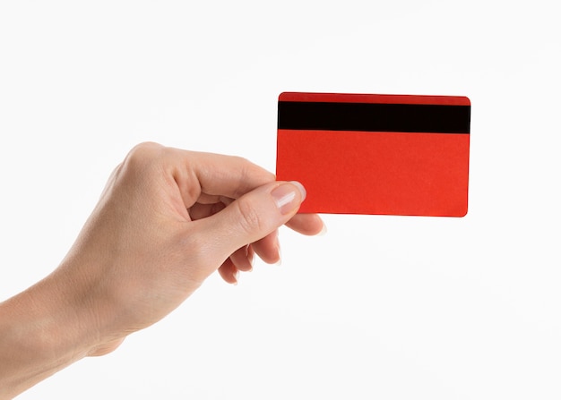 Photo gratuite main tenant une carte de crédit