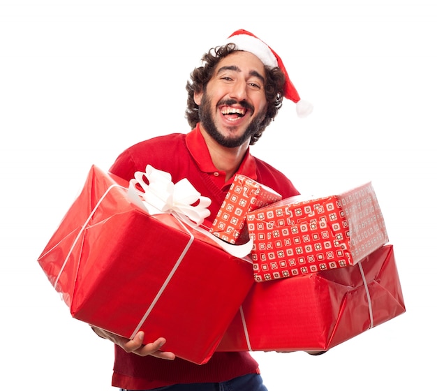 Man laughin gwith chapeau de père noël avec de nombreux cadeaux