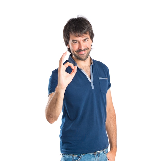 Man making Ok sign over white background