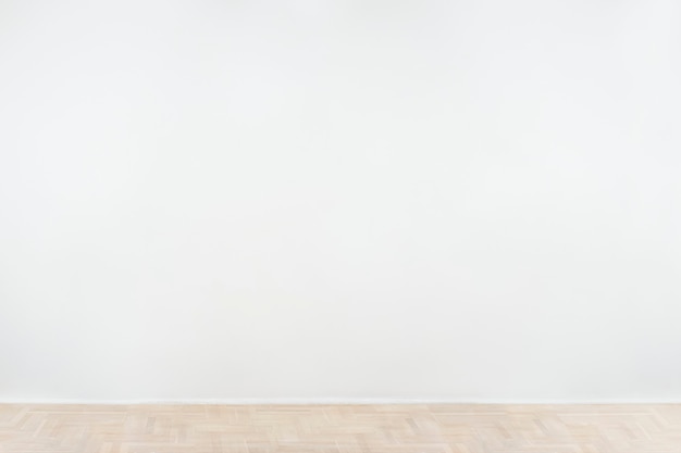Maquette de mur de béton vierge blanche avec un plancher en bois