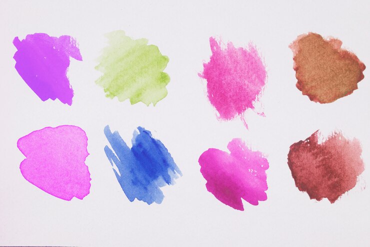 Photo gratuit mélange de peintures marron, verte, bleue, violette et rose sur papier blanc