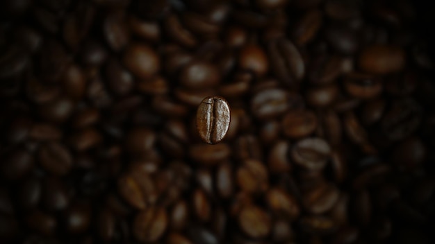 Photo gratuite mise au point sélective d'un grain de café torréfié sous les lumières avec un arrière-plan flou