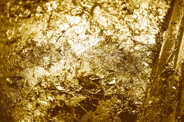 Des morceaux de fond texturé en feuille d'or