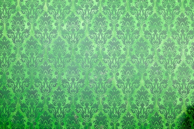 Motif vintage vert sur le vieux mur. Intérieur riche en motifs rétro vintage