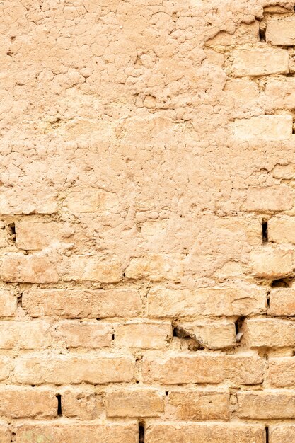 Mur en brique et ciment usé