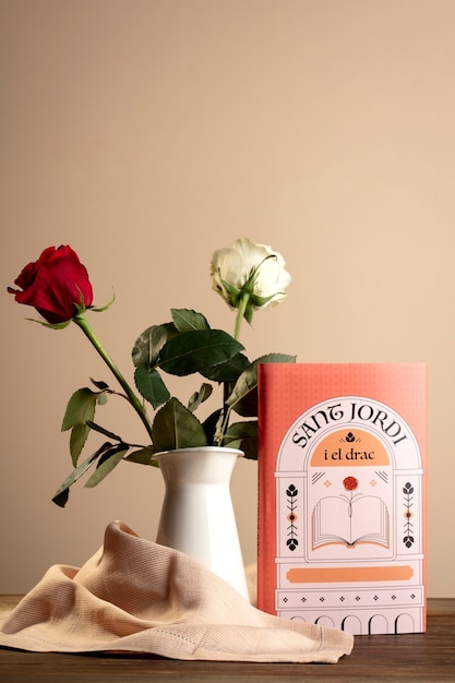 Photo gratuite la nature morte de sant jordi pour le jour des livres et des roses