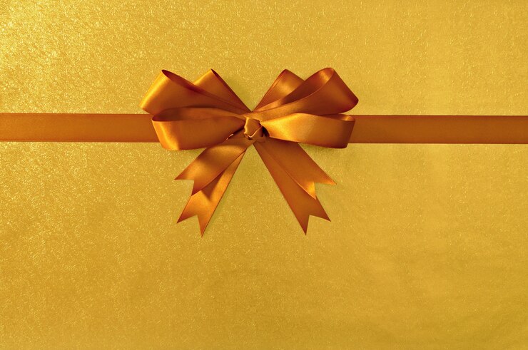 Photo gratuit or noël arc cadeau fond