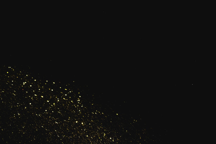 Photo gratuit paillettes jaunes sur fond sombre