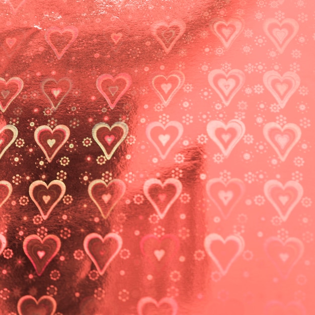 Photo gratuite papier chérie rose avec motif coeurs
