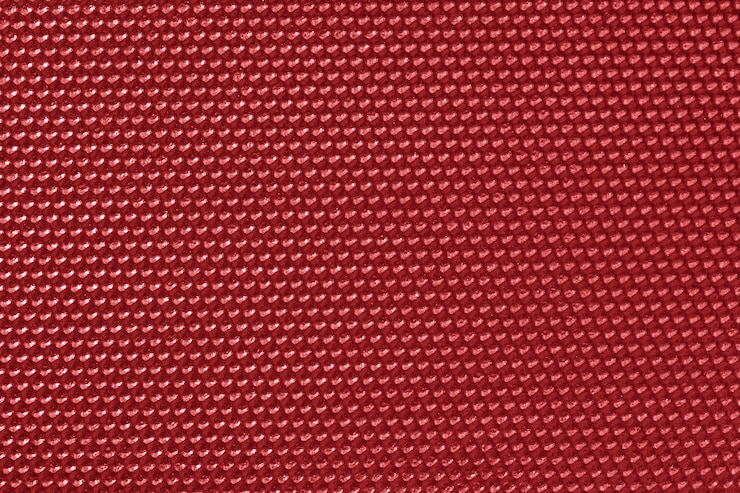 Photo gratuit papier peint motif nid d'abeille de couleur rouge