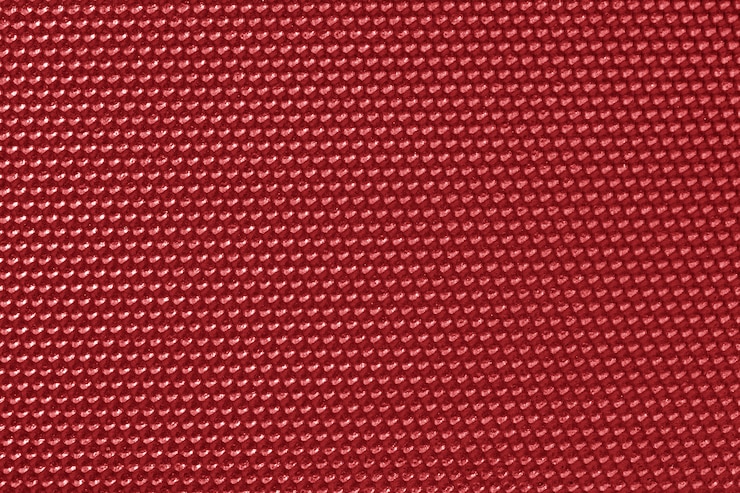 Photo gratuit papier peint motif nid d'abeille de couleur rouge