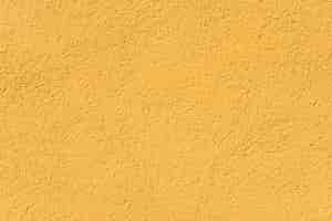 Photo gratuite paroi texturée de roche jaune