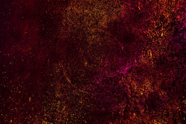 Particules De Poudre De Holi Coloré Sur Fond Noir