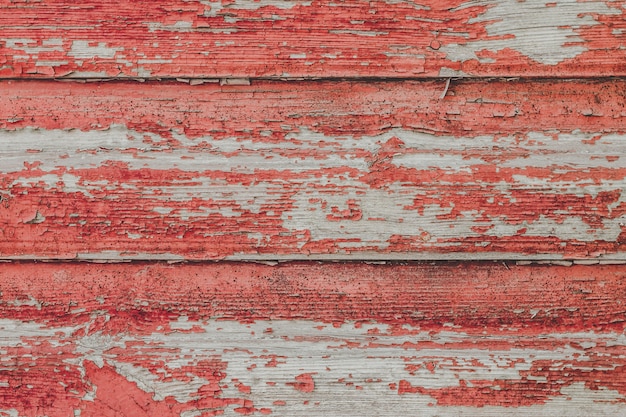 Peint le vieux fond de mur rouge en bois.