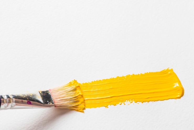 Photo gratuit peinture au pinceau de couleur jaune