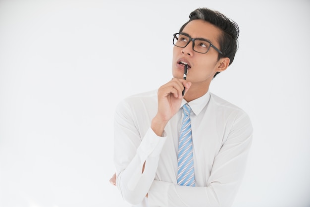 Pensive Asian Business Man Biting Pen