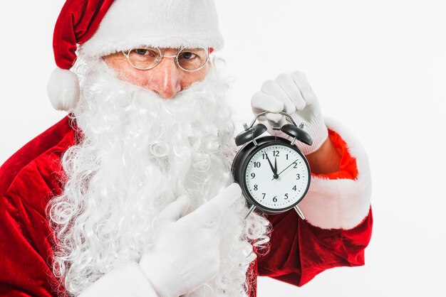 Père Noël pointant sur l&#39;horloge