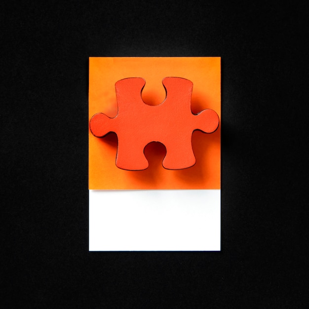 Photo gratuite pièce de puzzle de jeu de puzzle orange