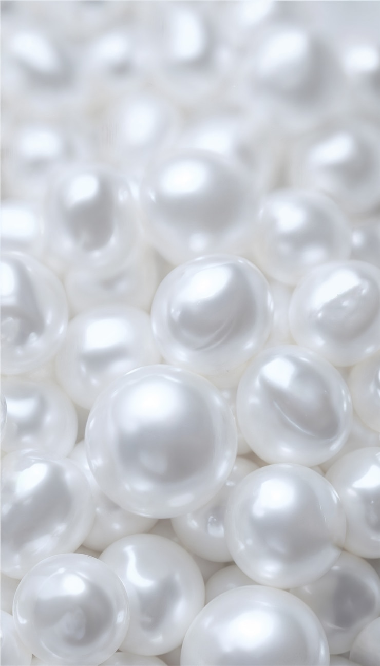 Photo gratuit une pile de perles blanches