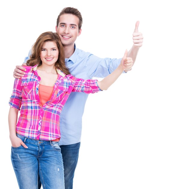 Photo gratuite portrait de couple heureux avec signe de pouce en l'air isolé