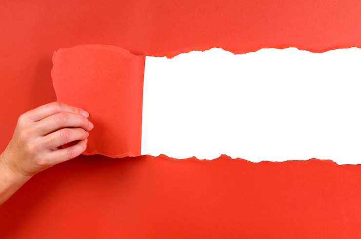 Photo gratuit red paper teared