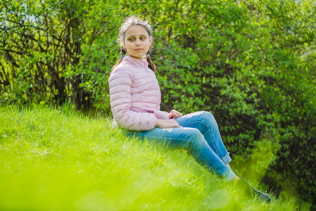 Relaxed girl sitting outside