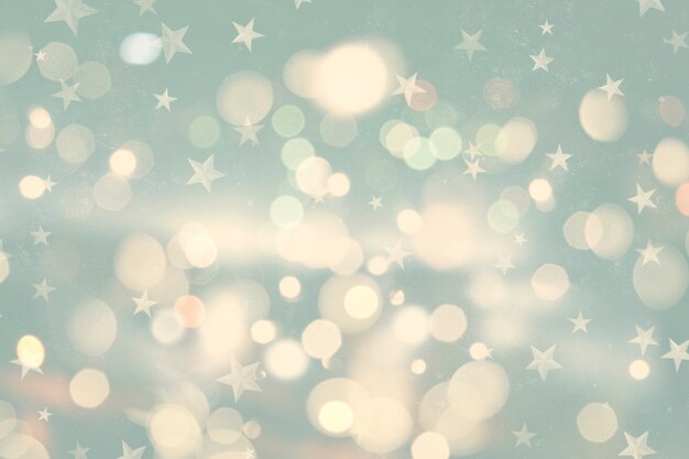 Rétro style de fond de Noël avec des lumières bokeh et étoiles