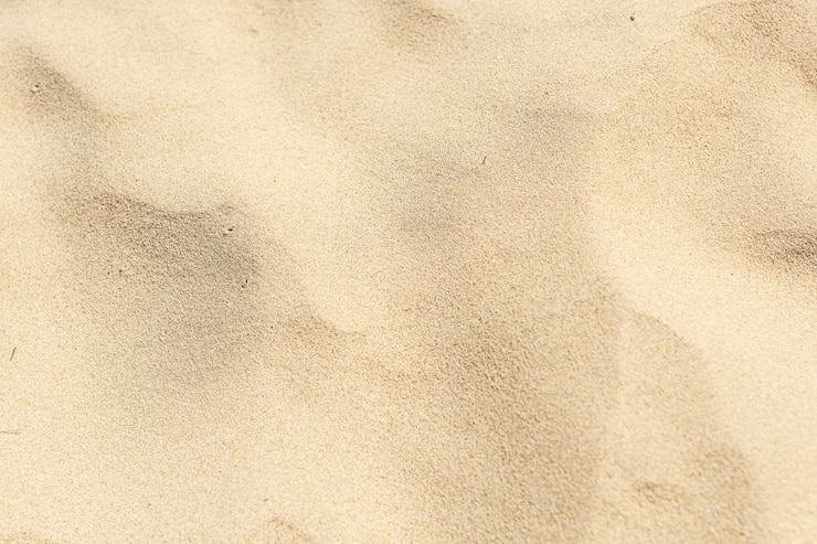 Photo gratuit sable jaune naturel sur le fond de la plage