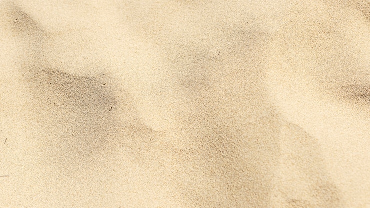 Photo gratuit sable naturel sur le fond de la plage