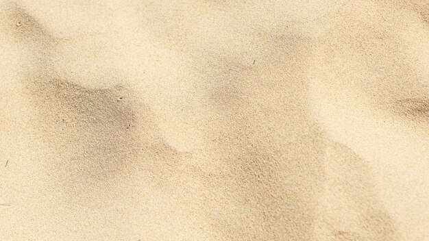 Sable naturel sur le fond de la plage