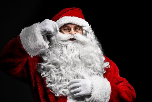 Senior man in santa claus costume at studio shot