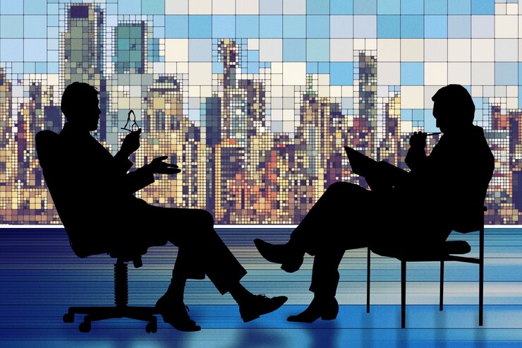 Photo gratuit silhouette de deux hommes d'affaires ayant une réunion