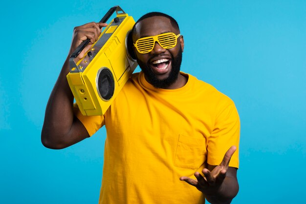 Smiley man holding cassette