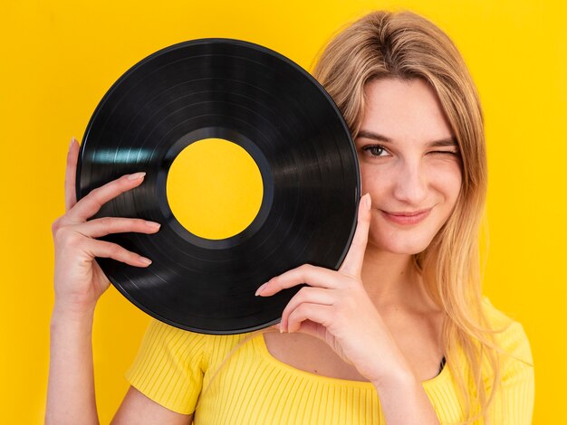 Smiley woman holding vinyl