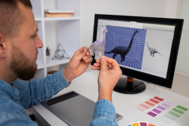 Photo gratuite le style de vie du concepteur utilisant une imprimante 3d